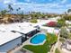 Aerial view of the home featuring a gorgeous backyard pool and desert landscaping in a quiet neighborhood at 6539 E Sharon Dr, Scottsdale, AZ 85254