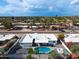 Aerial view of the home with a gorgeous backyard pool and modern landscaping in a quiet neighborhood at 6539 E Sharon Dr, Scottsdale, AZ 85254