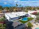 Aerial view of home featuring a backyard pool, covered patio, landscaping, and desert neighborhood at 6539 E Sharon Dr, Scottsdale, AZ 85254