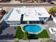 Arial view of the home showcasing the new roof, backyard pool, and updated desert landscaping at 6539 E Sharon Dr, Scottsdale, AZ 85254