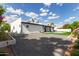 Spacious backyard featuring gravel, artificial turf, a pool, and a covered patio for outdoor enjoyment at 6539 E Sharon Dr, Scottsdale, AZ 85254