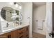 Updated bathroom featuring double vanity, white counters, and black hardware at 6539 E Sharon Dr, Scottsdale, AZ 85254