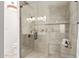 Modern bathroom featuring a glass shower with gray tile and a built-in seat at 6539 E Sharon Dr, Scottsdale, AZ 85254