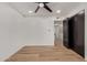 Inviting bedroom boasts wood-look flooring, neutral walls, and a spacious closet at 6539 E Sharon Dr, Scottsdale, AZ 85254