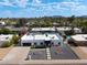 Front aerial view of a stunning home featuring desert landscaping, a new roof, and plenty of parking at 6539 E Sharon Dr, Scottsdale, AZ 85254