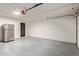 Spacious garage features a refrigerator, epoxy flooring, and plenty of room for storage at 6539 E Sharon Dr, Scottsdale, AZ 85254