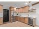 Well-equipped kitchen with stainless steel appliances, sleek cabinets, and ample counter space for cooking at 6539 E Sharon Dr, Scottsdale, AZ 85254