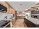 Open-concept kitchen showcases modern appliances, wood cabinets, and a bright, spacious layout at 6539 E Sharon Dr, Scottsdale, AZ 85254