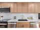 Beautiful kitchen with modern appliances, quartz countertops, subway tile backsplash, and stylish cabinetry at 6539 E Sharon Dr, Scottsdale, AZ 85254