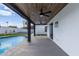 Covered patio with ceiling fans overlooking the pool and backyard, perfect for outdoor living and relaxation at 6539 E Sharon Dr, Scottsdale, AZ 85254