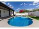 Backyard pool and patio, with a covered seating area and lush landscaping creating a private oasis at 6539 E Sharon Dr, Scottsdale, AZ 85254
