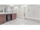 The main bathroom boasts double sinks, a glass shower, and tile floors at 681 W Belmont Red Trl, San Tan Valley, AZ 85143