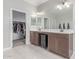 The main bathroom boasts double sinks, a closet, and tile floors at 681 W Belmont Red Trl, San Tan Valley, AZ 85143