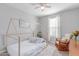 Relaxing bedroom featuring a wooden-frame twin bed, a ceiling fan, and a rocking chair at 681 W Belmont Red Trl, San Tan Valley, AZ 85143