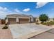 Charming single-Gathering home with a well-maintained yard, three-car garage, and stone accents at 681 W Belmont Red Trl, San Tan Valley, AZ 85143