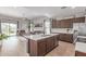 Spacious open-concept layout featuring kitchen, living, and dining areas at 681 W Belmont Red Trl, San Tan Valley, AZ 85143