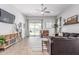 Comfortable living room with a large sliding glass door leading to the backyard at 681 W Belmont Red Trl, San Tan Valley, AZ 85143