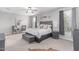 Spacious main bedroom featuring carpet floors, large windows, and gray furniture at 681 W Belmont Red Trl, San Tan Valley, AZ 85143