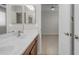 Bathroom and bedroom view with double sinks and light fixtures at 6870 S Justin Way, Chandler, AZ 85249