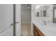 Bathroom and bedroom view with double sinks and light fixtures at 6870 S Justin Way, Chandler, AZ 85249