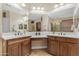 Bright bathroom with dual sinks, ample counter space, large mirrors, and updated fixtures at 6870 S Justin Way, Chandler, AZ 85249