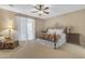 Spacious bedroom featuring a decorative wrought iron bed frame and ample natural light from large windows at 6870 S Justin Way, Chandler, AZ 85249