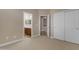 Bedroom with bathroom access and closet with sliding doors at 6870 S Justin Way, Chandler, AZ 85249