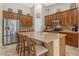 Kitchen with granite countertops, stainless steel appliances, breakfast bar, and ample cabinet space at 6870 S Justin Way, Chandler, AZ 85249
