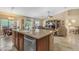 Kitchen island with breakfast bar that opens to the living room and dining area at 6870 S Justin Way, Chandler, AZ 85249