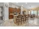 Spacious kitchen featuring granite countertops, a central island, and seamless flow to the dining area at 6870 S Justin Way, Chandler, AZ 85249