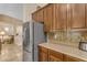 Close-up of a stainless steel refrigerator and beautiful backsplash in the kitchen at 6870 S Justin Way, Chandler, AZ 85249