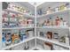 Organized pantry with ample shelving for optimal storage of all kitchen and food items at 6870 S Justin Way, Chandler, AZ 85249