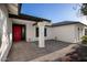 Charming single-story home with a well-maintained red front door and brick entrance at 7425 W Corrine Dr, Peoria, AZ 85381
