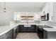 Updated kitchen with stainless steel appliances and views to backyard through window at 7425 W Corrine Dr, Peoria, AZ 85381