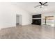 Bright living room with a black brick fireplace and sliding door access at 7425 W Corrine Dr, Peoria, AZ 85381