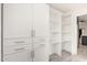 Bright pantry with white shelving and custom storage options at 7425 W Corrine Dr, Peoria, AZ 85381