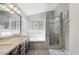 Bright bathroom boasting double vanity, a soaking tub and a separate glass shower at 7457 W Crystal Rd, Glendale, AZ 85308