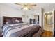 Comfortable bedroom with built-in headboard shelving and mirrored closet doors at 7457 W Crystal Rd, Glendale, AZ 85308