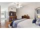 Spacious bedroom with wood floors, bathtub, and large storage cabinet at 7457 W Crystal Rd, Glendale, AZ 85308