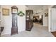 Spacious entryway with tiled floors, decorative furnishings, and access to living areas at 7457 W Crystal Rd, Glendale, AZ 85308