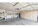 Organized garage featuring built-in cabinets, workspace, and ample storage solutions at 7457 W Crystal Rd, Glendale, AZ 85308