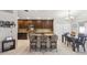 Spacious kitchen with granite countertops, island seating, and stainless steel microwave at 7457 W Crystal Rd, Glendale, AZ 85308