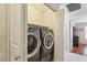Convenient laundry room with a full-size washer and dryer set at 7457 W Crystal Rd, Glendale, AZ 85308