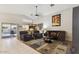 Cozy living room with comfortable seating, neutral color palette, and access to outdoor space at 7457 W Crystal Rd, Glendale, AZ 85308