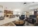 Open-concept living space with kitchen, dining area, and comfortable seating arrangement at 7457 W Crystal Rd, Glendale, AZ 85308