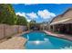 Beautiful backyard with a refreshing pool and outdoor kitchen, perfect for entertaining at 7457 W Crystal Rd, Glendale, AZ 85308