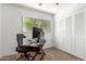 Bedroom or office with a desk and large window providing plenty of natural light at 7665 E Montecito Ave, Scottsdale, AZ 85251