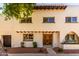 Charming two-story home with unique architectural details and a well-maintained front yard at 7665 E Montecito Ave, Scottsdale, AZ 85251