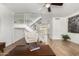 Open living area with staircase, offering a spacious and airy atmosphere with modern decor at 7665 E Montecito Ave, Scottsdale, AZ 85251