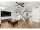 Bright and spacious living room with high ceilings, staircase, and modern finishes at 7665 E Montecito Ave, Scottsdale, AZ 85251